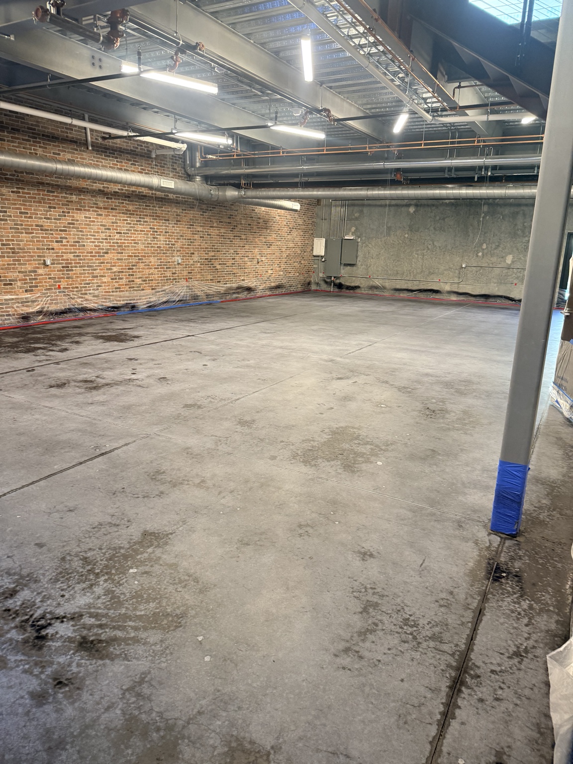 Concrete preparation stage with adjacent brickwork protected